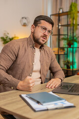 Sad Caucasian businessman looks pensive thinks over life concerns or unrequited love, suffers from...