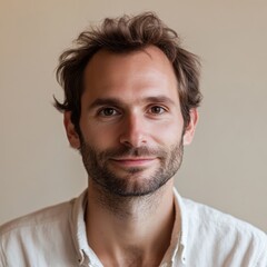 Obraz premium Portrait of a young man with casual style, friendly expression and natural light illuminating his face indoors. Generative AI