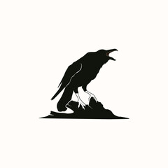 Black crow perched on a rock