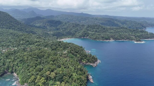Sao Tome and Principe - Angra Toldo Praia and Pico Maria Fernandes. Scenic Small Town Surrounded by Tropical Rainforest and Majestic Mountains.