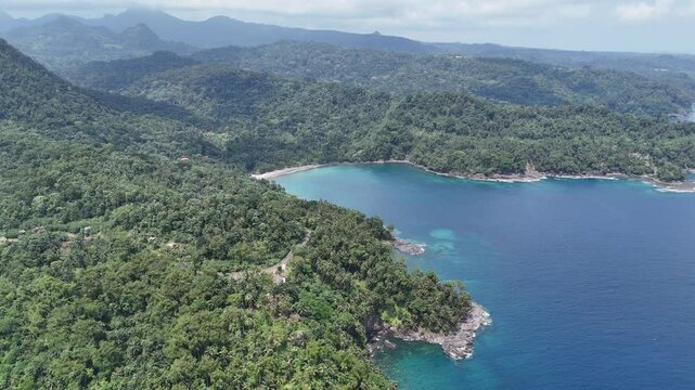 Sao Tome and Principe - Angra Toldo Praia and Pico Maria Fernandes. Scenic Small Town Surrounded by Tropical Rainforest and Majestic Mountains.