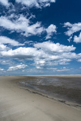 USA, South Carolina. Clouds reflected on wet beach, Kiawah Island.