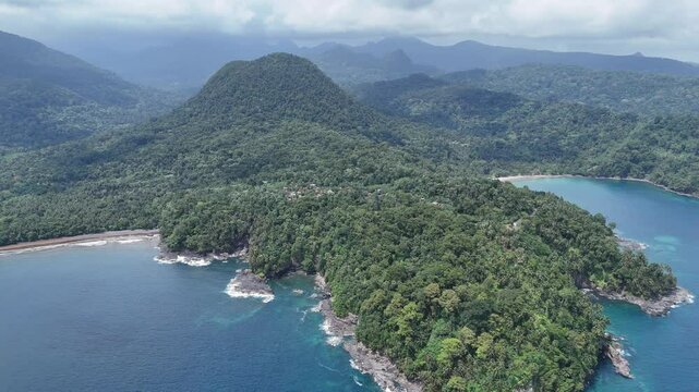 Sao Tome and Principe - Angra Toldo Praia and Pico Maria Fernandes. Scenic Small Town Surrounded by Tropical Rainforest and Majestic Mountains.