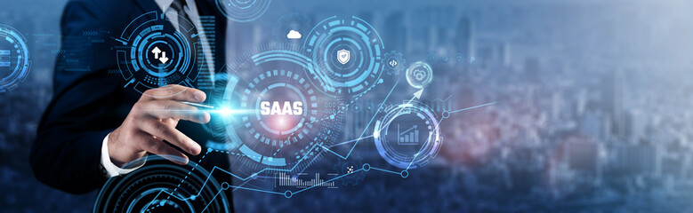 SaaS: Businessman analyzing technological data and cloud solutions, subscription models, software deployment, user access, scalability, integration capabilities, and business efficiency.