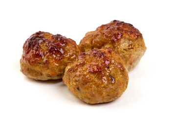 Baked pork meatballs, isolated on white background.