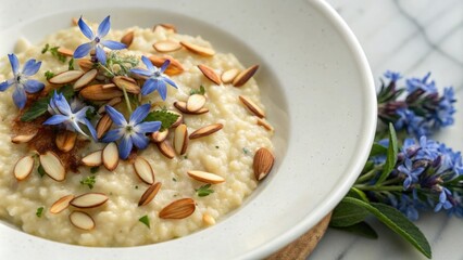 Creamy risotto with borage and toasted almonds, fresh borage, culinary art, golden lighting