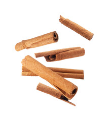 Cinnamon sticks crushed in the air close up on a transparent background