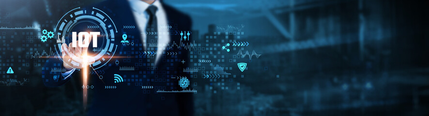 IoT: Connectivity, automation, sensors, devices, smart technology, data analytics, integration, Businessman analyses Internet of Things (IoT) technological data.