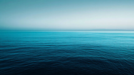 Fototapeta premium The ocean is calm and blue, with no visible waves or ripples