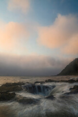 USA, Oregon, Cape Perpetua and Thor's Well at sunset
