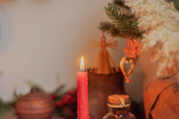 Red candle on a festive Christmas table
