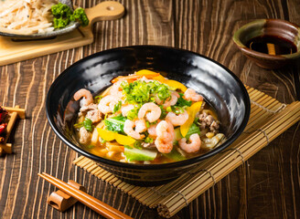 Fried Oolong with Shrimp served in bowl isolated on wooden background side view of taiwan food