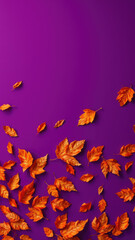 Obraz premium dry orange metallic leaves on violet background, orange and purple hues, nature patterns
