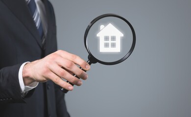 Hand holding house. Real estate concept