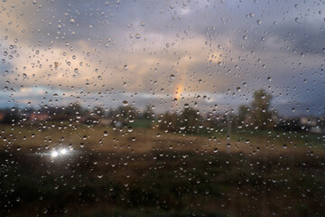 Obraz premium rainbow rain drops glass sky