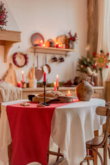 Red candle on a festive Christmas table