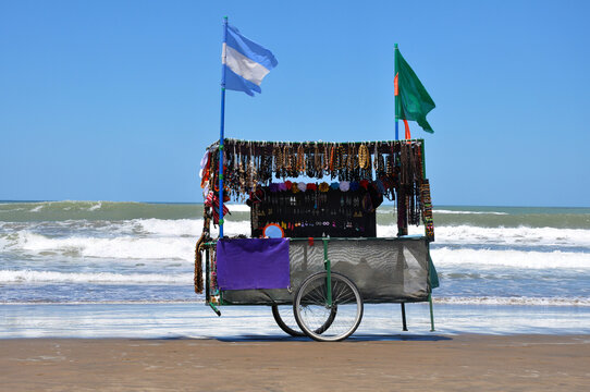 tand of multi-colored necklaces on Carilo beach in Argentina