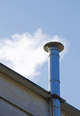 chimney of the house from which a lot of smoke comes out of the heating system and generates pollution