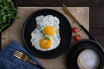Sunny-side up  style Eggs with coffee on the side