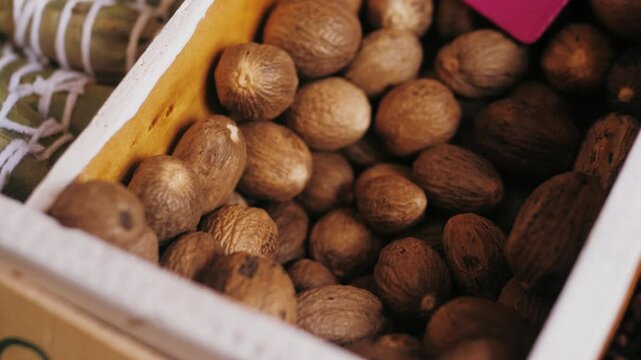 This product features assorted whole nutmeg seeds beautifully packaged in a wooden box