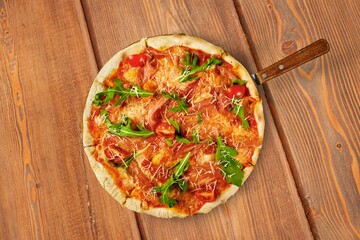 Delicious fresh hot pizza on wooden table