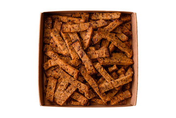 Crispy homemade brown bread crackers or croutons with seeds and grains