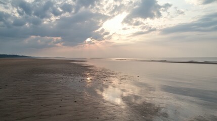 Obraz premium Serene beach sunset, calm waves, cloudy sky, tranquil scene, nature wallpaper