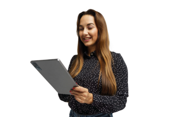 Woman smiling while using a tablet in a bright, minimalistic environment during daytime