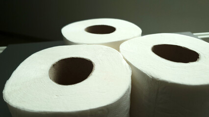 Set of soft toilet paper rolls in bathroom