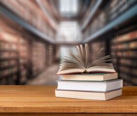 Books for reading on wooden table in library