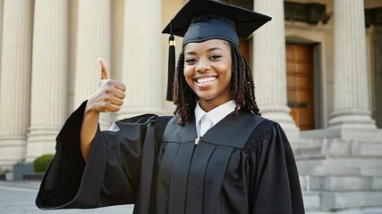 4k video of a graduation student showing thumbs up.