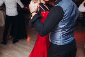 Couples dancing traditional latin argentinian dance milonga in the ballroom, tango salsa bachata...