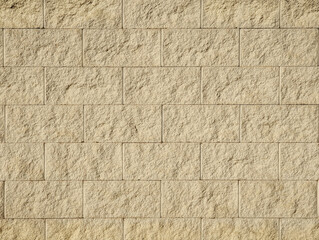 Natural cream beige flagstone cladding texture for interior or exterior, wall, dividing wall, facade. Off-white elegant textured stone slabs or limestone blocks background.