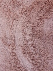 Close up of a pink artificial rose fur