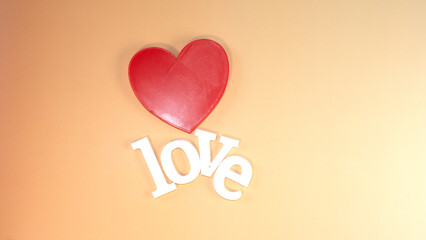 Red heart with letters that say love, love and friendship day, February 14, Valentine's Day