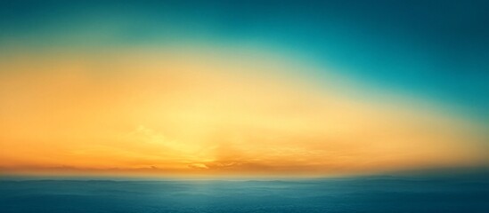 Obraz premium Serene sunset over distant mountains with vibrant colors blending into the sky, ideal for relaxation