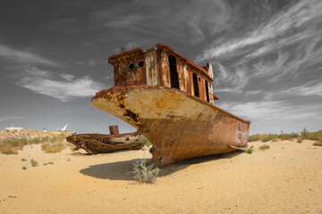 Rusting shipwrecks on what used to be the seabed of the Aral Sea. The Aral Sea has lost significant...