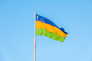 Waving flag of Karakalpakstan Republic,  in Nukus, capital city of Karakalpakstan