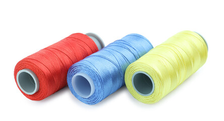 Spools of bright sewing threads isolated on white