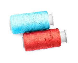 Spools of bright sewing threads isolated on white, top view