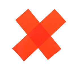 Fototapeta premium Cross made of red adhesive tape on white background, top view