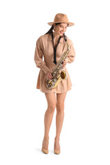 Female artist with saxophone on white background