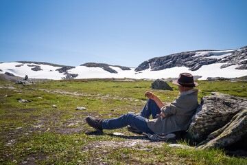 Man having a rest when hiking in the mountains