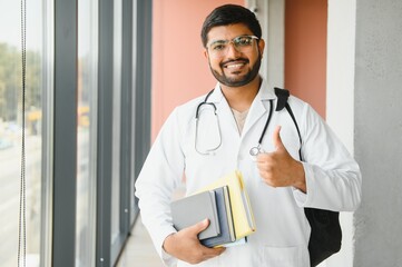 multiracial South Asian medical students with a medical court and stethoscope. medical student life
