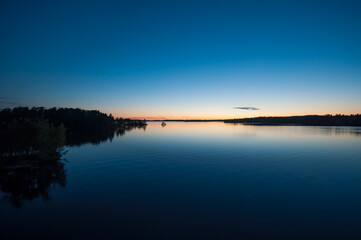 Early summer night by a calm lake in Finland