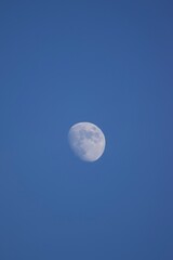 full moon over blue sky