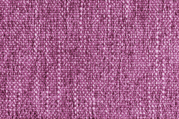 Pink Jacquard fabric with large loose woven, coarse weave texture upholstery cloth. Textile background, furniture textile material, wallpaper, backdrop. Cloth structure close up, macro.