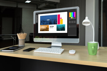 Naklejka premium Graphic designer software for modern design of web page and commercial ads showing on the computer screen