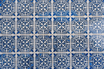 Traditional Portuguese azulejo tiles with intricate blue and white patterns.