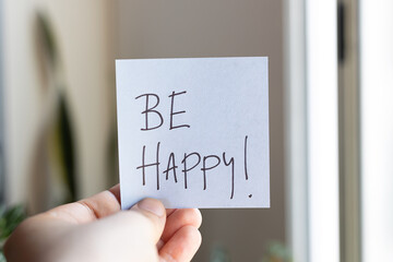 Sticky Notes with 'Be Happy' on Paper